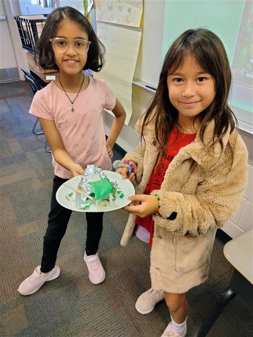 Two students show their work.