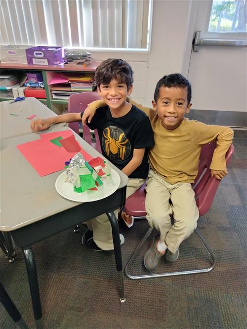 Two students show their work.