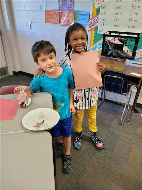 Two students show their work.
