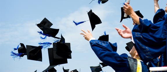 Students throwing graduation caps