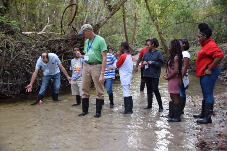 Students in creek